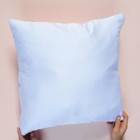 person-holding-a-white-pillow-free-photo