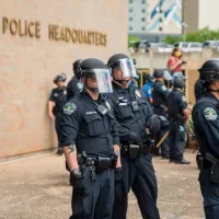 Austin^ Texas police officers w/protesters demonstrating against police brutality outside of City of Austin Police Department headquarters; May 30^ 2020:
