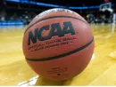 NCAA basketball/game ball sits on court