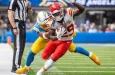 KC Chiefs running back Kareem Hunt #29 runs past LA Chargers linebacker Daiyan Henley #0 during an NFL football game at SoFi Stadium^ Aug. 17^ 2024^ in Inglewood^ Calif.