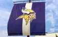 Minnesota Vikings practice facility and flag. The Minnesota Vikings are a professional American football team based in Minneapolis^ Minnesota. EDEN PRAIRIE^ MN/USA - August 13^ 2015