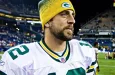 Quarterback Aaron Rodgers walks on Qwest Field after winning a football game August 21^ 2010 in Seattle^ Washington.