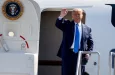 President Donald Trump waves as he steps off Air Force One at John Wayne Airport^ Santa Ana^ Calif.^ on Sunday Oct. 18^ 2020.