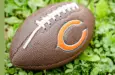 Football with Chicago Bears logo the on grass. Chicago Bears of the National Football Conference North. Rockford^ WI / USA.- Feb 12^ 2019