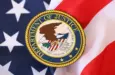 US Department of Justice seal on United States of America flag close up