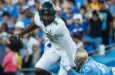 Colorado quarterback Shedeur Sanders #2 is tackled by UCLA defensive line Laiatu Latu #15 during an NCAA college football game between the UCLA and the Colorado^ Oct. 28^ 2023^ in Pasadena^ Calif.