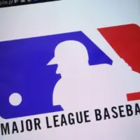 Major League Baseball logo displayed on a modern smartphone KONSKIE^ POLAND - SEPTEMBER 07^ 2018