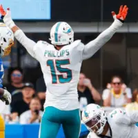 Miami Dolphins linebacker Jaelan Phillips (15) celebrates after an interception against the Los Angeles Chargers during an NFL football game^ Sept. 10^ 2023^ in Inglewood^ Calif.