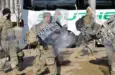 California National Guard troops prepare to board a bus for their return home after completing their assignment in Washington during the inauguration. Washington^ DC – January 22^ 2021