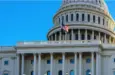 Close-up of the United States flag in front of the Capitol Building's dome in the morning^ Washington^ D.C.