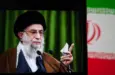 This image captures Iranian Supreme Leader Ali Khamenei giving a speech^ with the Iranian flag prominently displayed.
