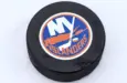 New York Islanders logo on Ice hockey puck outdoors in snow OREBRO^ SWEDEN - FEBRUARY 3^ 2019