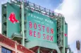 Vew of the historic architecture of the Famous Fenway Park Stadium in Boston^ MA^ USA showcasing its huge sign^ old brick walls^ and entrances on Lansdowne street. Boston^ MA^ USA - March 1^ 2023