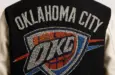 OKLAHOMA CITY THUNDER IN ALL RHINESTONES AS PATCH ON BACK OF MENS VARSITY JACKET AI-generated image / This content was generated by an Artificial Intelligence (AI) system.