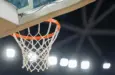 Basketball hoop hanging in a sports stadium waiting for the ball