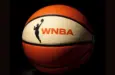 AI Generated photo featuring basketball with the WNBA logo^ background is completely black with ball illuminated artistically. (This content was generated by an Artificial Intelligence (AI) system.)