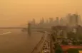 View on June 7^ 2023 of hazy New York city skylines during bad air quality because smoke of Canadian wildfires brought in by wind