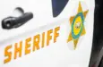 Close-up of a Los Angeles County Sheriff's Department badge and lettering on the side of a patrol vehicle. 2024-11-15 Los Angeles USA