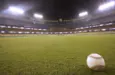 Selective focus of baseball in outfield grass at Dodger Stadium Los Angeles - October 12^ 2022