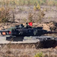 Pabrade Lithuania A Leopard 2A7 main battle tank is captured in action^ firing its main cannon during a live-fire exercise. 10-13 - 2020