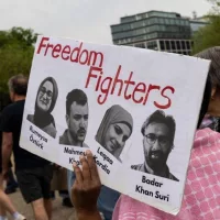 Demonstrators gather during a protest in front of the White House in Washington^ DC^ on April 19^ 2025.