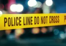 Yellow Tape Showing Text "Police Line Do Not Cross" Restricting a Crime Scene Area At Night. Close Up Aesthetic Shot with Bokeh Effect and Flickering Lights. Criminal on the Loose Strikes Again