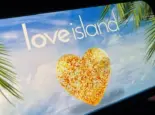 '2025 Love Island'' shown on a smart phone. is a reality dating show that originated in the UK. The premise involves a group of singles living together in a luxurious villa^ where they couple up Toronto^ Canada - June 5
