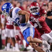 NCAA Football^ BYU 38:31 Ark- Cougars WR Parker Kingston (82) catches a pass fights off Razorbacks DB Lorando Johnson (1) the game at Razorback Stadium^ Fayetteville^ AR. Sept 16^ 2023