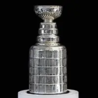 NHL ceremony - Stanley Cup trophy on the white stand^ black background^ Vancouver BC - October 22^ 2018