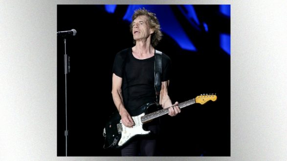 getty_mickjagger630_withguitar_092518
