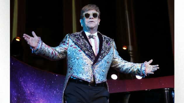 m_eltonjohnarmsspread_030918-2