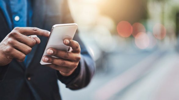 istock_manchecksphone_121819