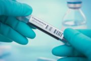 istock_11121_covidbloodvialhands