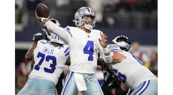 Arlington, United States. 24th Dec, 2022. Dallas Cowboys Dak Prescott gets  stopped by and Philadelphia Eagles T.J. Edwards during their NFL game at  AT&T Stadium in Arlington, Texas on Saturday, December 24