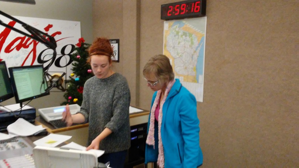 Raina and Sara confer before Sara goes on the air