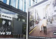 Oasis album cover artwork on display outside the Oasis live 25 shop in Manchester Manchester^ UK - 26 June 2025