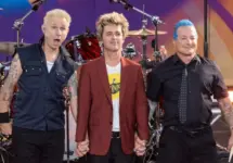 Mike Dirnt^ Billie Joe Armstrong^ Tre Cool pose on stage during ABC Good Morning America rock group Green Day concert in Central Park in New York on July 26^ 2024