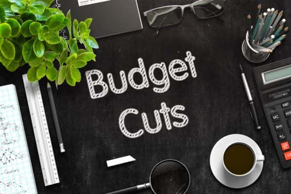 budget-cuts-text-on-black-chalkboard-3d-rendering