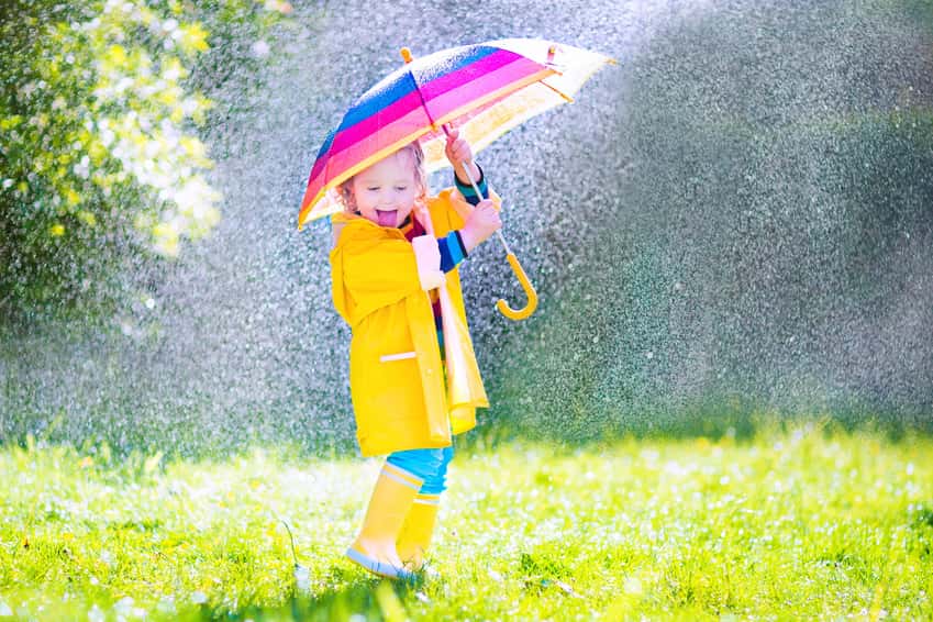 funny-little-toddler-with-umbrella-playing-in-the-rain
