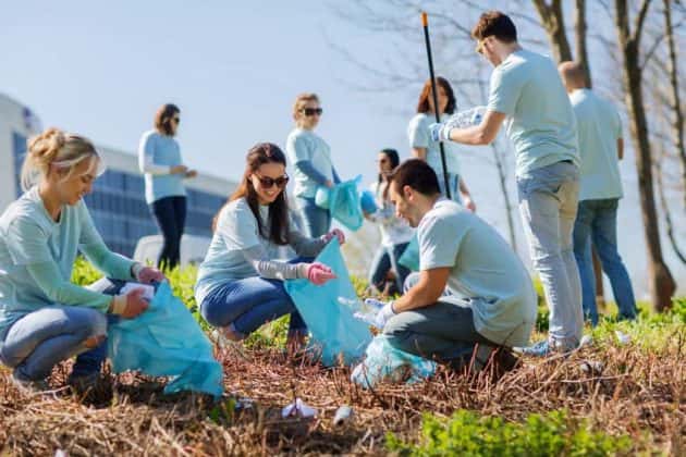 volunteers-with-garbage-bags-cleaning-park-area