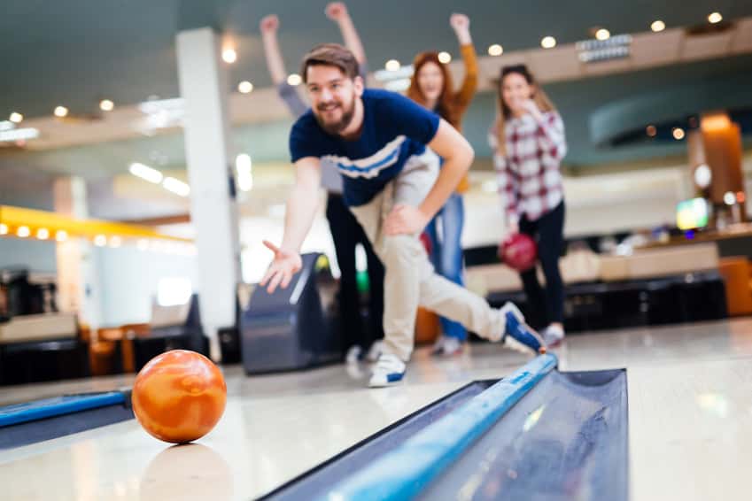 friends-having-fun-while-bowling