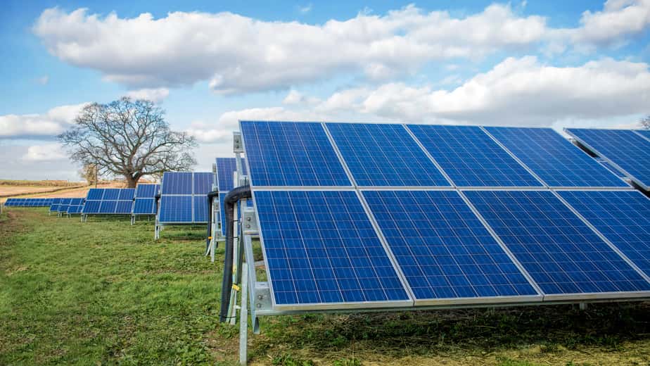 solar-farm-park-green-fields-blue-sky-sustainable-renewable-energy