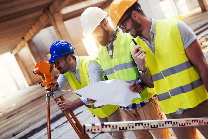 portrait-of-construction-engineers-working-on-building-site