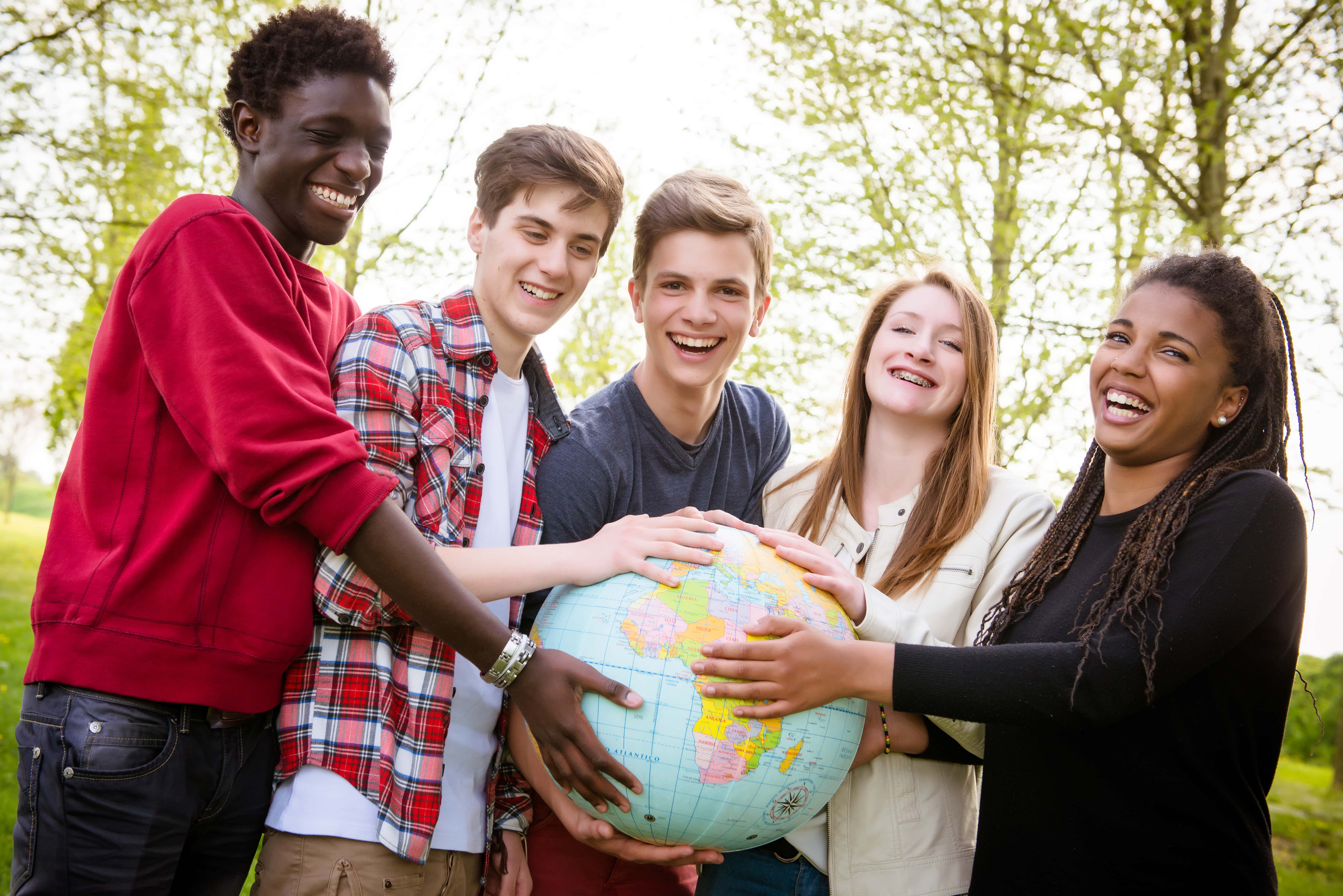 teenagers-holding-globe