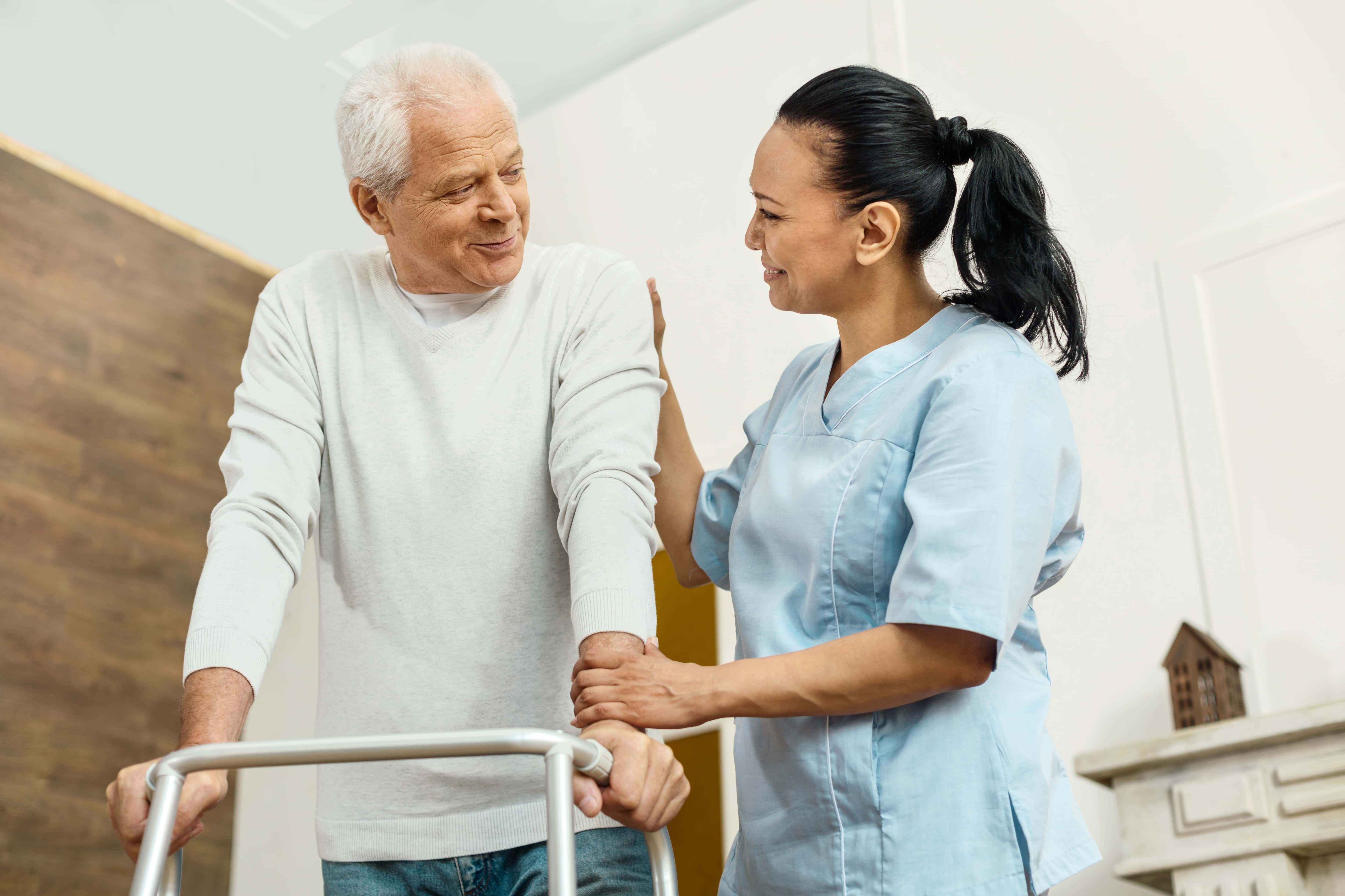 nurse-helping-elderly-man