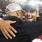APTOPIX NFC Championship Packers 49ers Football: San Francisco 49ers quarterback Jimmy Garoppolo, right, celebrates with assistant coach Miles Austin after the NFL NFC Championship football game against the Green Bay Packers Sunday, Jan. 19, 2020, in Santa Clara, Calif. The 49ers won 37-20 to advance to Super Bowl 54 against the Kansas City Chiefs. (AP Photo/Tony Avelar)