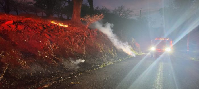 Fire crews mop up a fire along Chalk Hill Road.