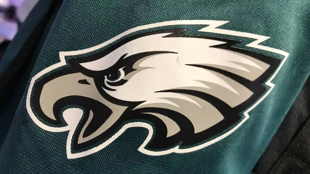 Closeup of the arm/sleeve displaying the official logo on a Philadelphia Eagles jersey