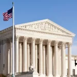 Facade of US Supreme court in Washington DC on sunny day