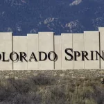 Colorado Springs city entry monument with Pikes Peak in the background. Colorado Springs^ CO